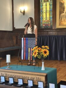 Lisa Bechok sings the National Anthem during the First Responder Appreciation Ceremony.