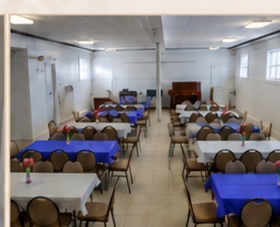 Fellowship Hall at Rev. George L. Fox Memorial Chapel with tables and chairs set up for an event